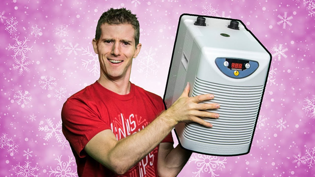 Linus Sebastian holding an air conditioning unit